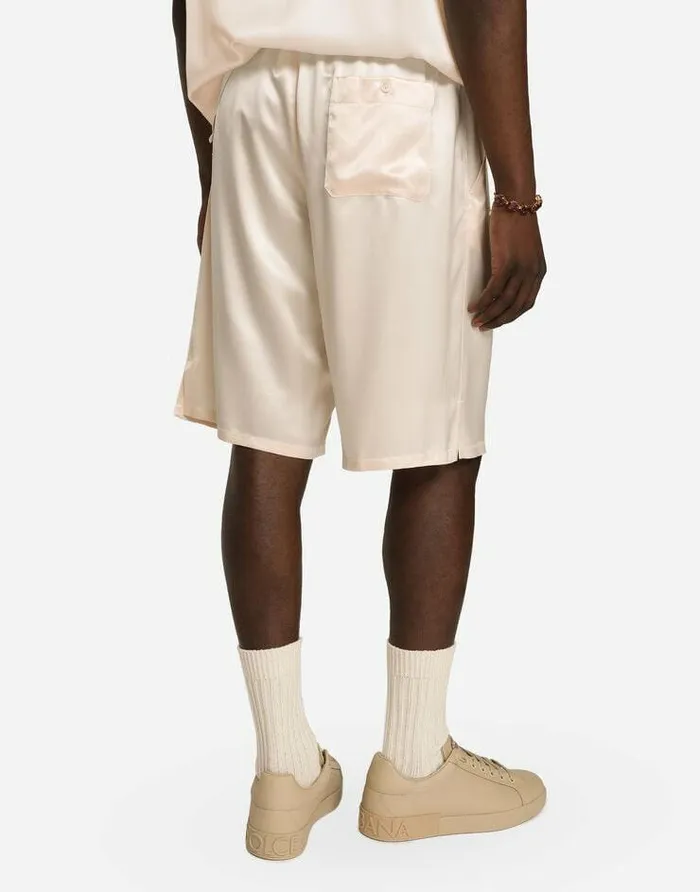 Dolce and Gabbana Trousers And Shorts Men Silk Satin Jogging Shorts With Metal DG Logo Pale Pink Dolce and Gabbana Trousers And Shorts Men Silk Satin Jogging Shorts With Metal DG Logo Pale Pink
