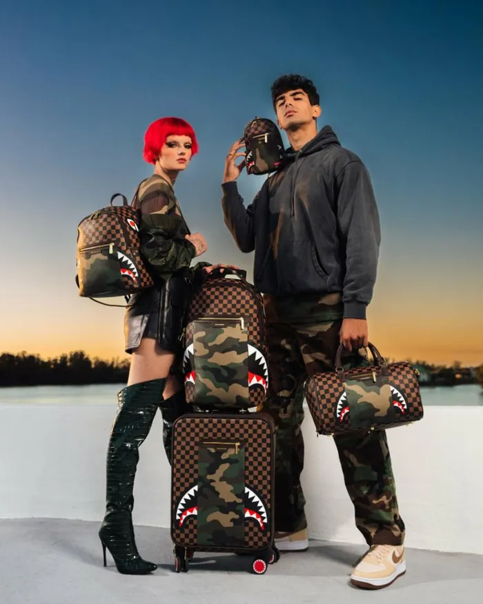 SPRAYGROUND EXTERIOR GOLD ZIP POCKET SHARKS IN PARIS MESSENGER SLING BAG Bags