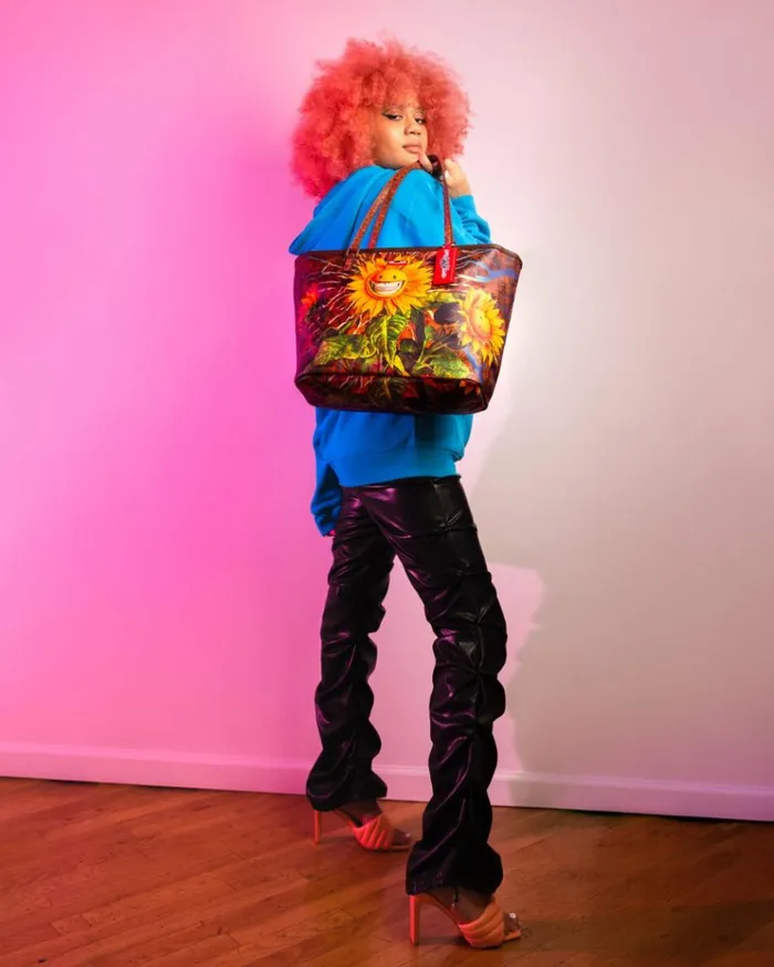 SPRAYGROUND SUNFLOWER GRIN RON ENGLISH COLLAB TOTE Bags