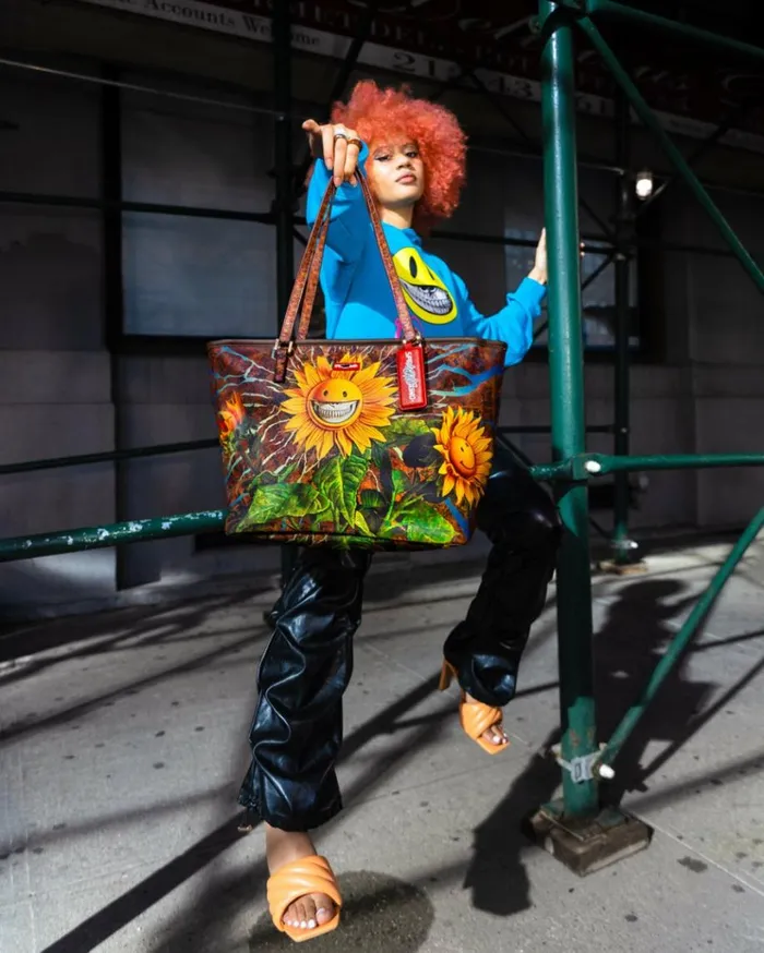 SPRAYGROUND SUNFLOWER GRIN RON ENGLISH COLLAB TOTE Bags